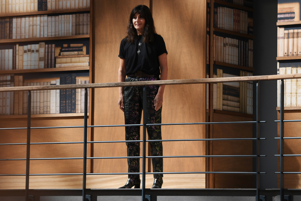 In this file photo taken July 2, 2019 French fashion designer Virginie Viard acknowledges the audience at the end of the Chanelu00e2u20acu2122s Women Fall-Winter 2019/2020 Haute Couture collection fashion show at the Grand Palais turned into a giant library in Paris.