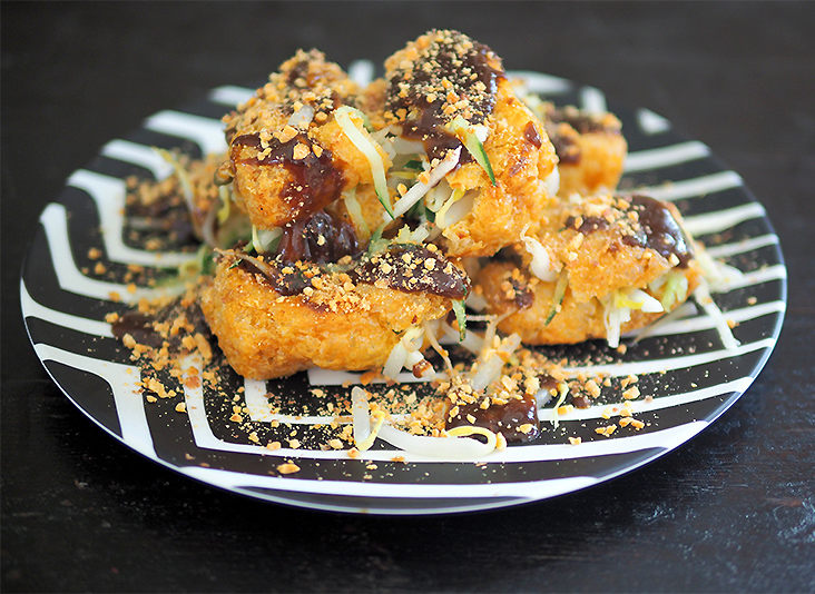 The 'tau fu bakar' is drizzled with the pungent prawn sauce and sprinkled with toasted peanuts.