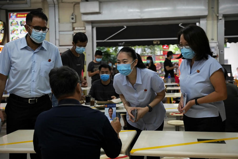 The Workersu00e2u20acu2122 Partyu00e2u20acu2122s Sylvia Lim (right), Pritam Singh (left) and new face Tan Chen Chen (centre) on a walkabout near Soo Teck LRT station, July 3, 2020. u00e2u20acu201d TODAY pic