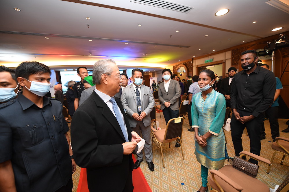 Pavithra and Sugu meeting Prime Minister Tan Sri Muhyiddin Yassin in Putrajaya. u00e2u20acu201d Bernama pic