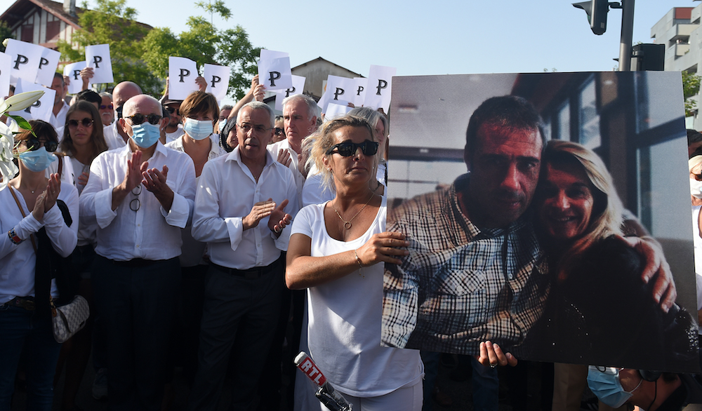 Veronique Monguillot, wife of bus driver Philippe Monguillot, declared brain dead after being attacked for refusing to let aboard a group of people who were not wearing face masks, holds a picture of her husband in Bayonne July 8, 2020. u00e2u20acu201d AFP pic