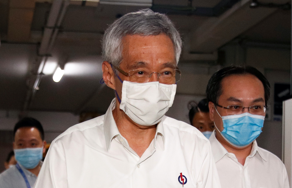 Singapore's Prime Minister Lee Hsien Loong arrives at a People's Action Party branch office, as ballots are being counted during the general election, in Singapore July 11, 2020. u00e2u20acu201d Reuters pic 