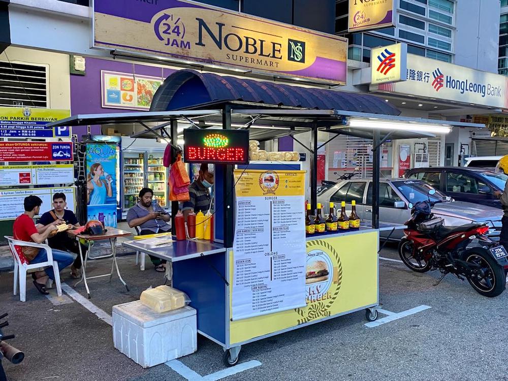 A burger stall in Taman Perling... business has been very slow. — Picture by Ben Tan