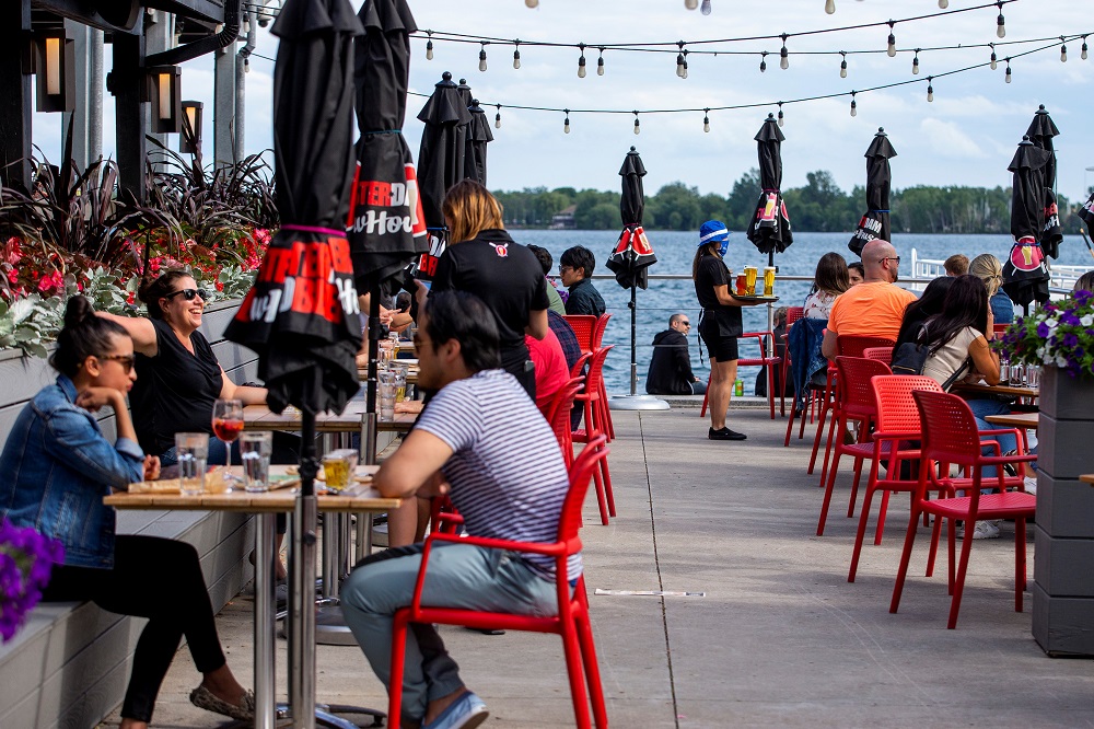 People enjoy drinks and food at Amsterdam Brewhouseu00e2u20acu2122s patio, as the provincial phase 2 of reopening from the Covid-19 restrictions begins in Toronto, Ontario June 24, 2020. u00e2u20acu201d Reuters pic