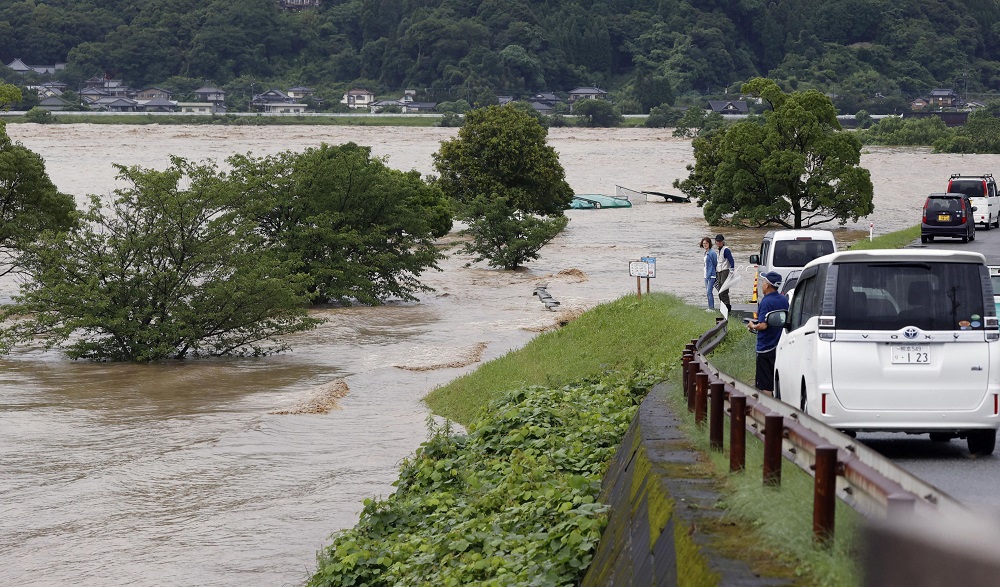 Rising water caused by a heavy rain is seen along Kuma river in Yatsushiro, Kumamoto prefecture, southern Japan July 4, 2020. u00e2u20acu201d Picture by Kyodo via Reuters