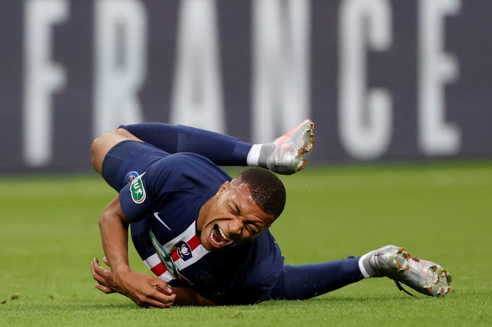 Paris St Germainu00e2u20acu2122s Kylian Mbappe reacts after sustaining an injury, following the outbreak of the coronavirus disease, in Paris July 24, 2020. u00e2u20acu201d Reuters pic