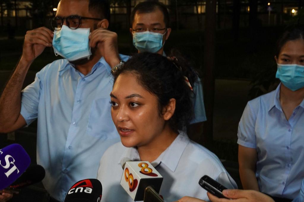 Workers' Party candidate Raeesah Khan is pictured speaking to the media on Sunday night (July 5). nu00e2u20acu201d TODAY