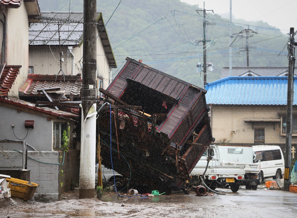 A building structure washed away by flooding due to torrential rain is seen on a street in Hitoyoshi, Kumamoto prefecture on July 5, 2020. u00e2u20acu201d AFP pic