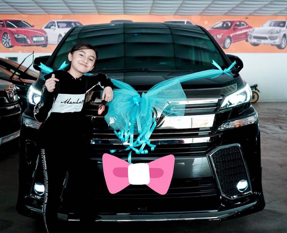 Singing sensation Alyssa Dezek poses with her new luxury MPV which costs more than RM250,000. u00e2u20acu201d Picture from Instagram/Alyssa Dezek