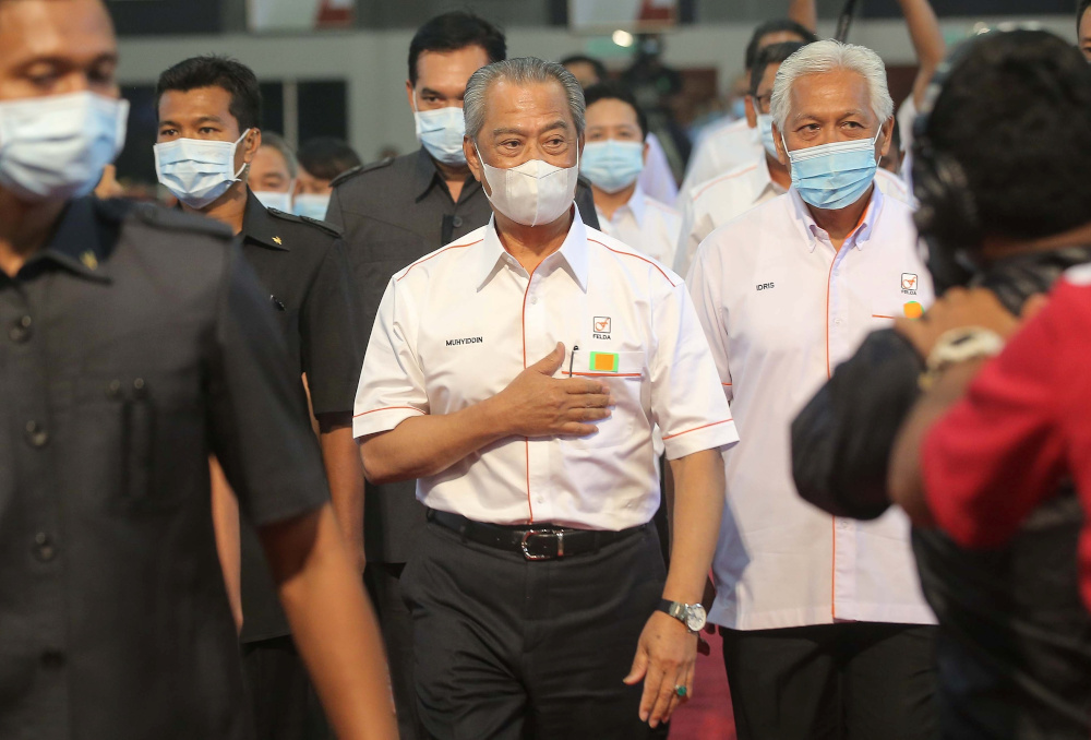 Prime Minister Tan Sri Muhyiddin Yassin arrives at the national level 2020 Felda Settlers Day at the Felda Mara Junior Science College (MRSM) Tun Abdul Razak Campus in Trolak July 7, 2020. — Picture by Farhan Najib