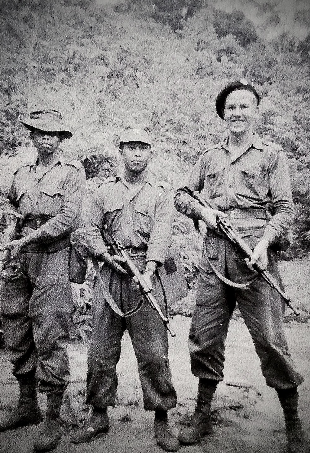 Lt. Peter Julius with two of his men, Ahmad (left) and Wahab (centre) at the swamp in Kebun Bahru, Pagoh, Johor in May 1956. — Picture courtesy of Peter Julius 