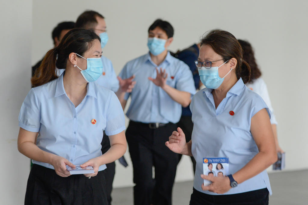 WPu00e2u20acu2122s Sengkang GRC candidate He Ting Ru (left) and WP chairman Sylvia Lim (right) at Rivervale Plaza on July 7, 2020. u00e2u20acu201d TODAY pic