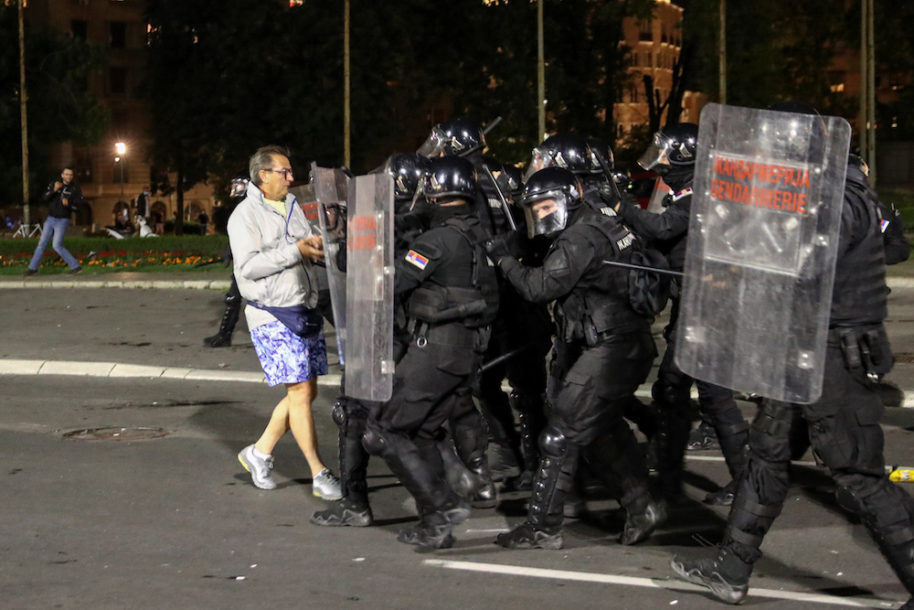 A demonstrator confronts with security forces officers during a protest against a lockdown planned for the capital this weekend to halt the spread of the coronavirus disease (Covid-19) in Belgrade, Serbia July 7, 2020. u00e2u20acu201d Reuters pic