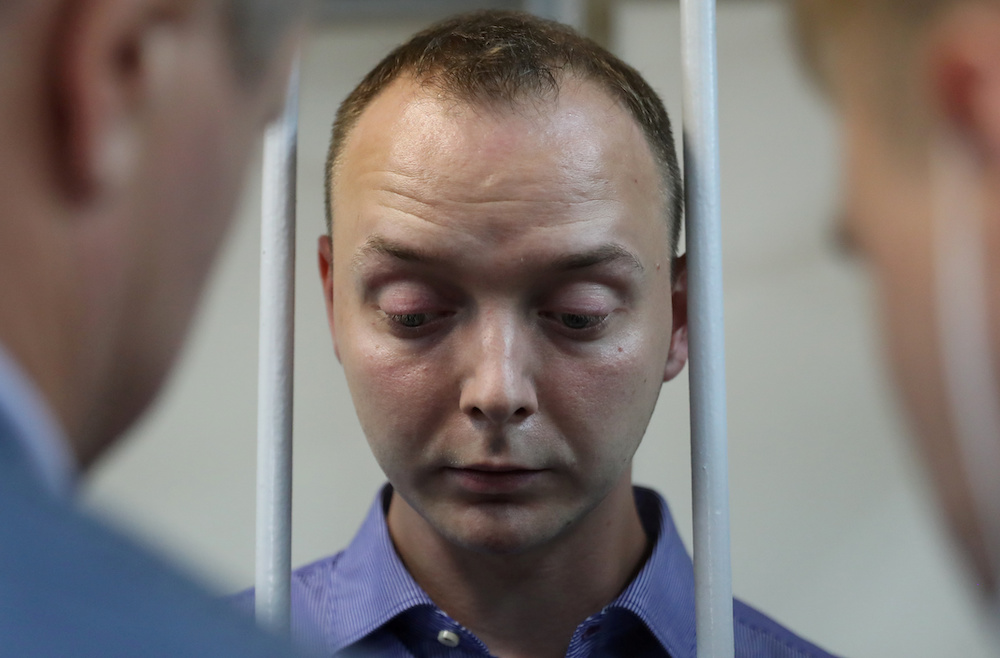 Ivan Safronov, a former journalist who works as an aide to the head of Russia's space agency Roscosmos, detained on suspicion of treason, stands inside a defendants' cage before a court hearing in Moscow, Russia July 7, 2020. u00e2u20acu201d Reuters picn n