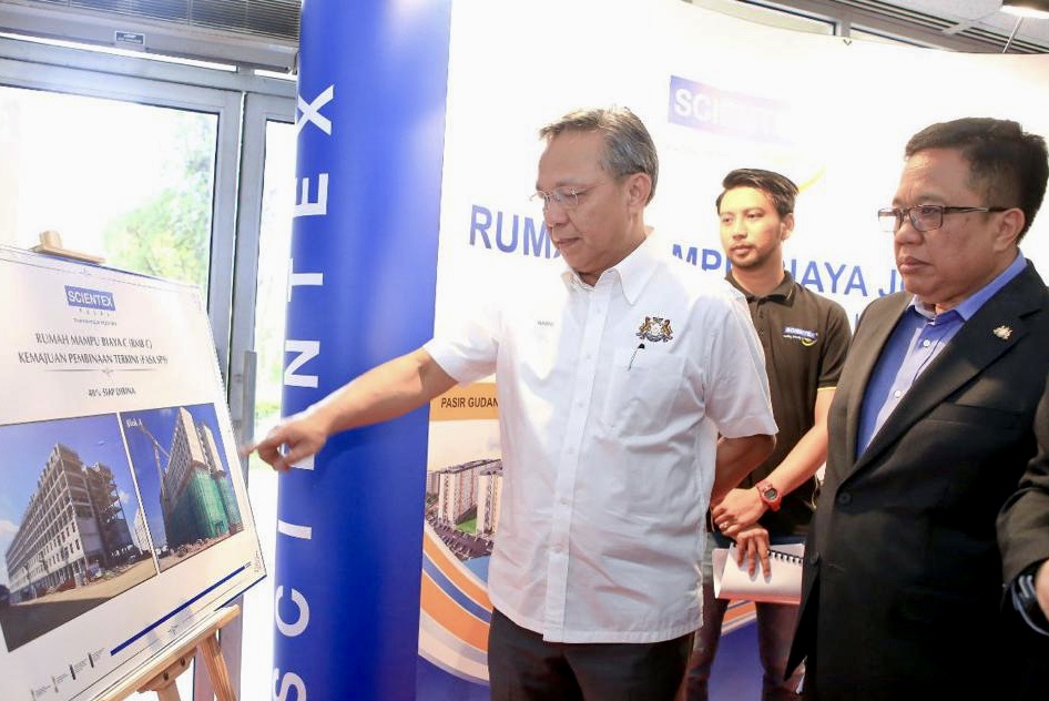Johor Mentri Besar Datuk Hasni Mohammad (left in white) during the affordable homes balloting programme in Johor RTM that was broadcasted live on Facebook today. u00e2u20acu201d Picture courtesy of the Johor Mentri Besaru00e2u20acu2122s office