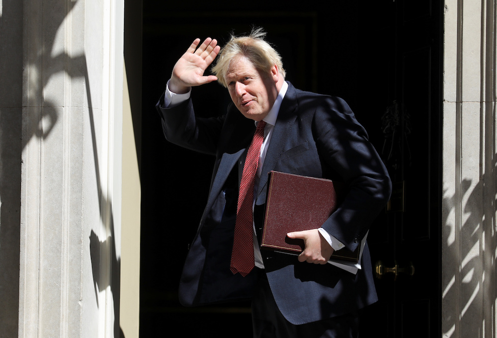 Britain's Prime Minister Boris Johnson waves after a face-to-face meeting of his cabinet team of ministers, the first since mid-March because of the coronavirus disease (Covid-19) pandemic, in London July 21, 2020. u00e2u20acu201d Reuters picnn