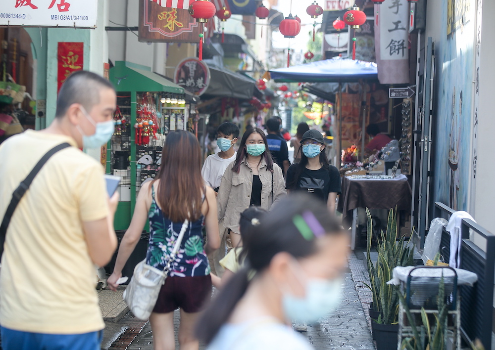 Domestic tourists visit Ipohu00e2u20acu2122s Concubine Lane.  After months of lockdown due to the Covid-19 pandemic, Ipoh Town is gradually returning to its lively bustling atmosphere as tourist spots attract domestic tourists. u00e2u20acu201d Picture by Farhan Najib