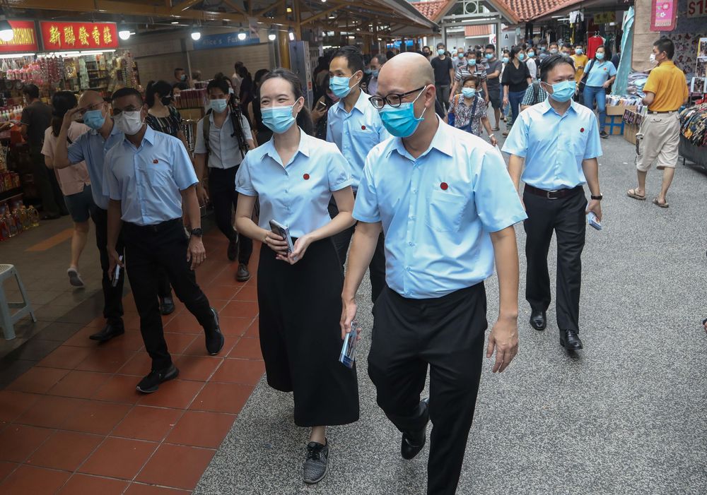 The Workers’ Party team contesting for the East Coast GRC at a walkabout in Bedok North, July 1, 2020. — Picture by Raj Nadarajan/TODAY