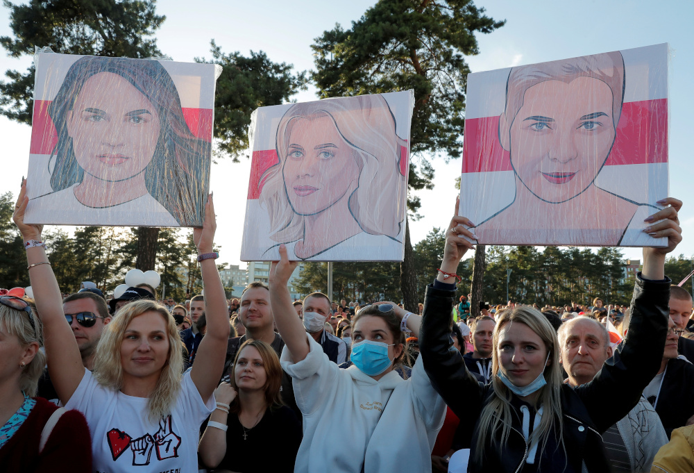 People hold portraits of Svetlana Tikhanouskaya, Veronika Tsepkalo, and Maria Kolesnikova, during an election campaign rally in Borisov, Belarus July 23, 2020. u00e2u20acu201d Reuters pic 