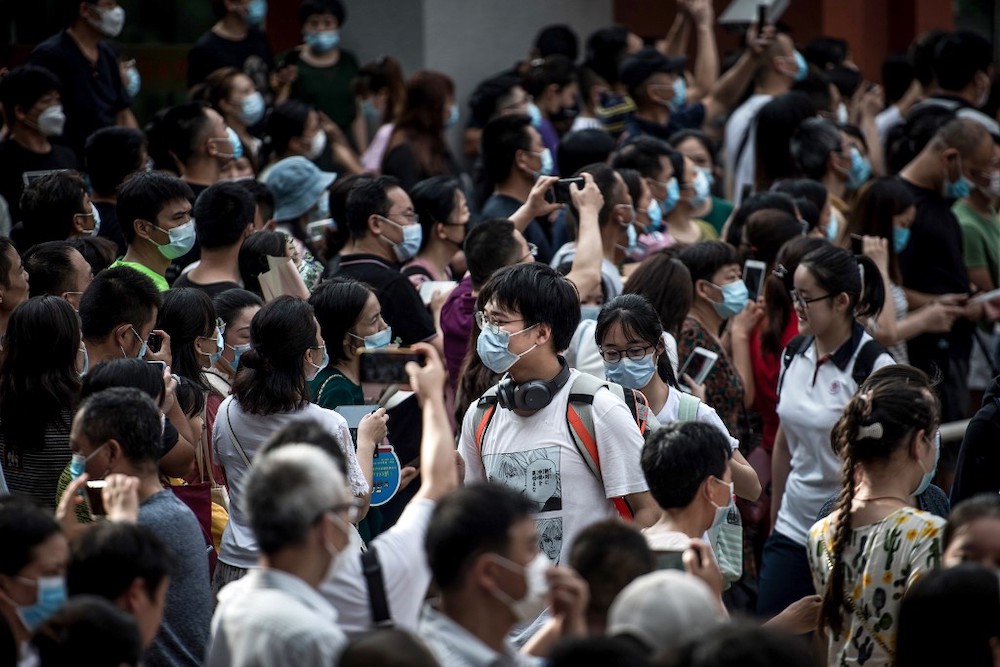 Students walk outside a school after finishing the National College Entrance Examination, known as u00e2u20acu02dcgaokaou00e2u20acu2122, outside a school in Wuhan in China's central Hubei province on July 8, 2020. u00e2u20acu201d AFP picnn
