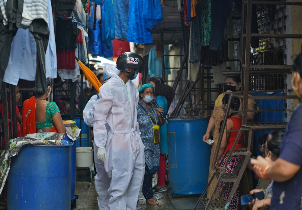 A worker from Bharatiya Jain Sanghatana, a non-governmental organisation, screens the residents during a check-up campaign for the coronavirus disease in a slum Mumbai, India, July 23, 2020. u00e2u20acu201d Reuters pic 