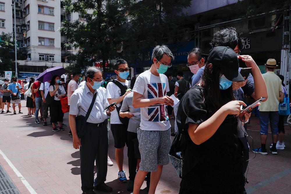 Voters queue up to vote during primary elections aimed for selecting democracy candidates, in Hong Kong, China July 11, 2020. u00e2u20acu201d Reuters picnnn