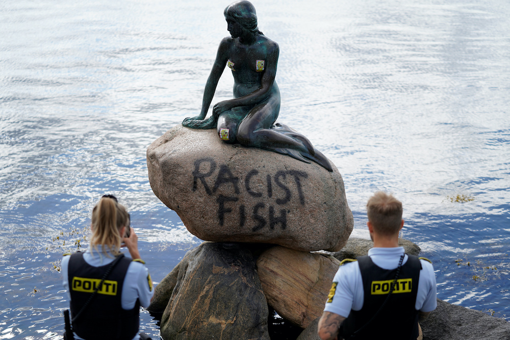 A graffiti reading u00e2u20acu02dcRacist Fishu00e2u20acu2122 is seen on a statue of u00e2u20acu02dcThe Little Mermaidu00e2u20acu2122 in Copenhagen, Denmark July 3, 2020. u00e2u20acu201d Reuters picnnn