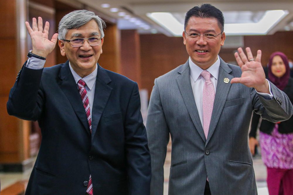 Former Dewan Rakyat Speaker Tan Sri Mohamad Ariff Md Yusof and Deputy Speaker Nga Kor Ming wave at reporters in Parliament July 13, 2020. u00e2u20acu201d Picture by Hari Anggara
