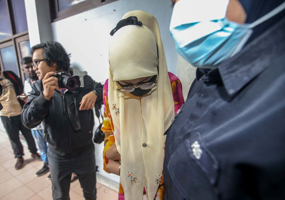 Sergeant (probation) Raja Nur Hasliza Raja Zainal Abidin, 25, arrives at the Ipoh Sessions Court July 13, 2020. u00e2u20acu201d Picture by Farhan Najib