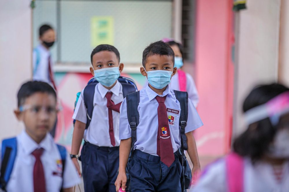 Sekolah Kebangsaan Pandan Perdana students on their first day back at school in Kuala Lumpur July 22, 2020. u00e2u20acu201d Picture by Hari Anggara