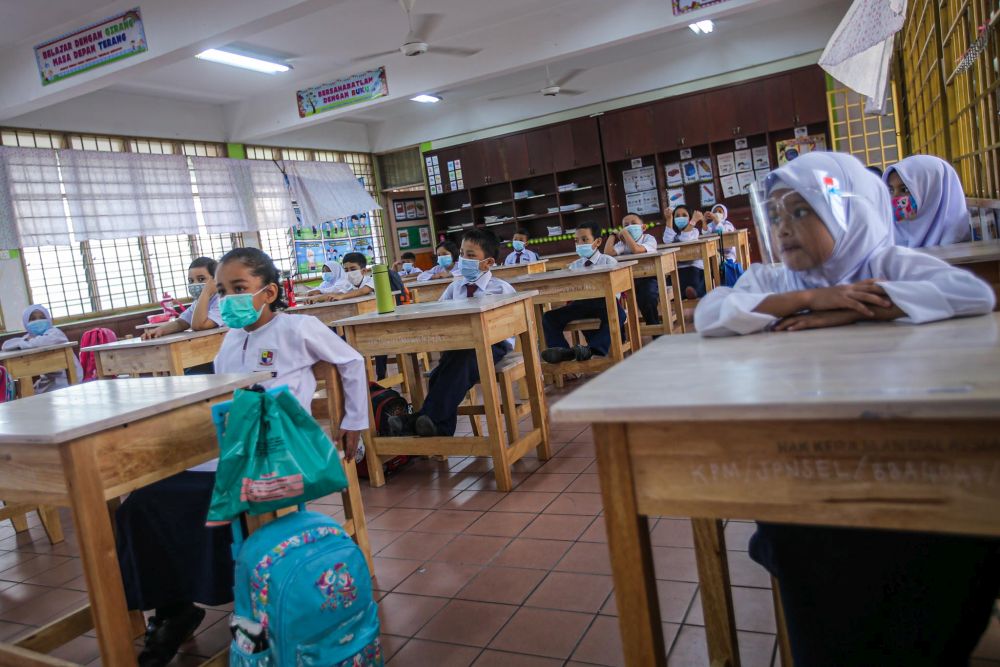 Sekolah Kebangsaan Pandan Perdana students on their first day back at school in Kuala Lumpur July 22, 2020. u00e2u20acu201d Picture by Hari Anggara