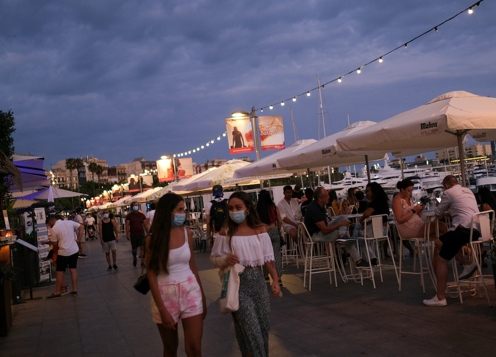 People sit on terraces of restaurants, after Catalonia's regional authorities and the city council announced restrictions to contain the spread of the coronavirus disease in Barcelona, Spain July 17, 2020. u00e2u20acu201d Reuters picnn