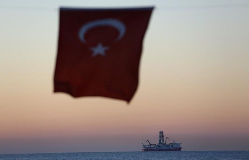 The Turkish national flag hangs in the foreground as drilling vessel Fatih is seen off the Mediterranean resort city of Antalya, Turkey October 30, 2018. u00e2u20acu201d Reuters pic