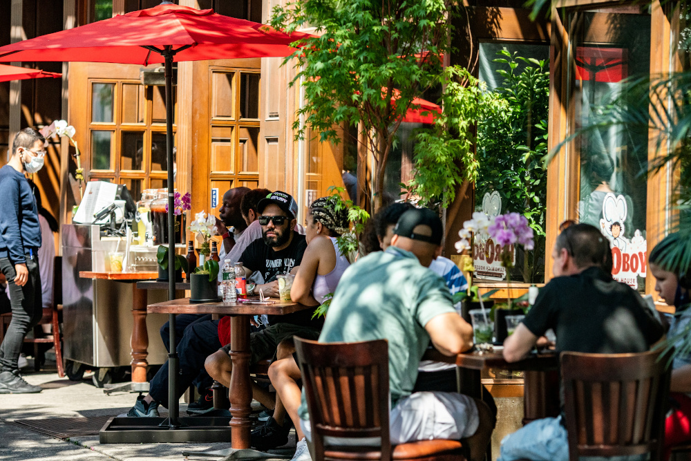 People eat in outdoor seating outside a restaurant before the city starts phase two of reopening after the lockdown due to the coronavirus disease, in the Manhattan borough of New York City, June 21, 2020. u00e2u20acu201d Reuters pic 