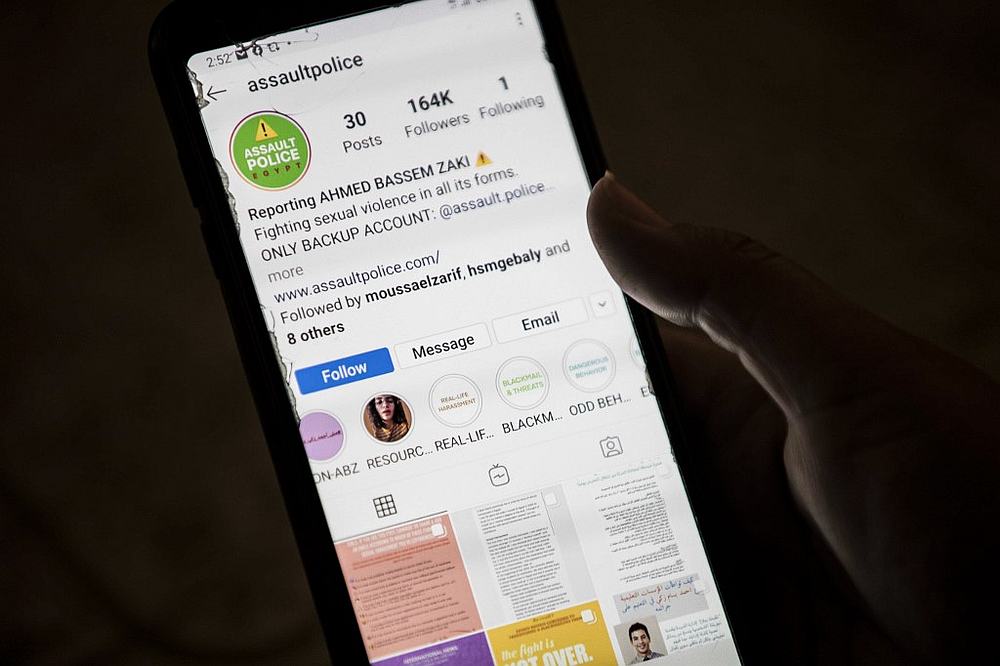 A woman checks an Instagram account for reporting allegations of sexual harassment and misconduct against Ahmed Bassam Zaki, a 22-year-old student, in Cairo July 15, 2020. u00e2u20acu201d AFP pic 