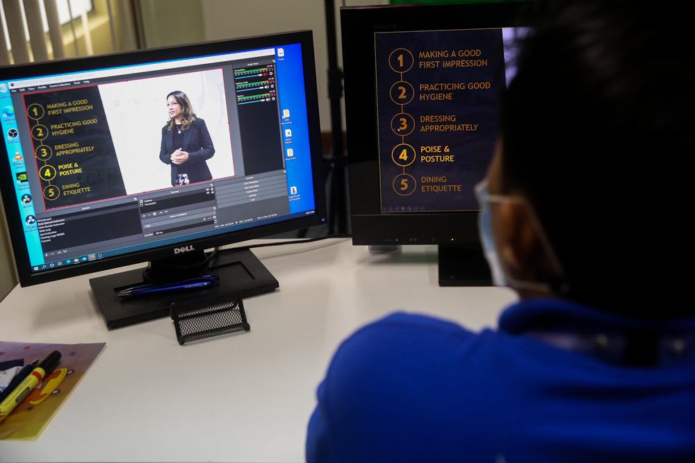 Staff from the MAB Academy train themselves to record and edit videos to create the online modules for trainees. u00e2u20acu201d Picture by Choo Choy May 