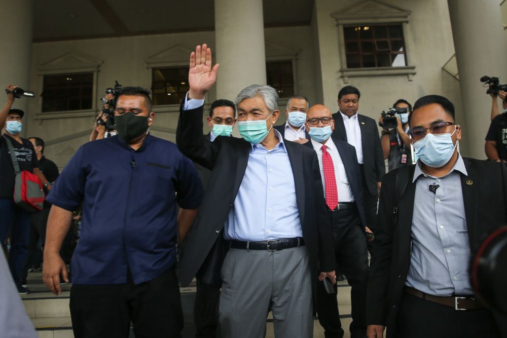 Umno president Datuk Seri Dr Ahmad Zahid Hamidi waves at supporters at the Kuala Lumpur High Court July 28, 2020. u00e2u20acu2022 Picture by Yusof Mat Isa