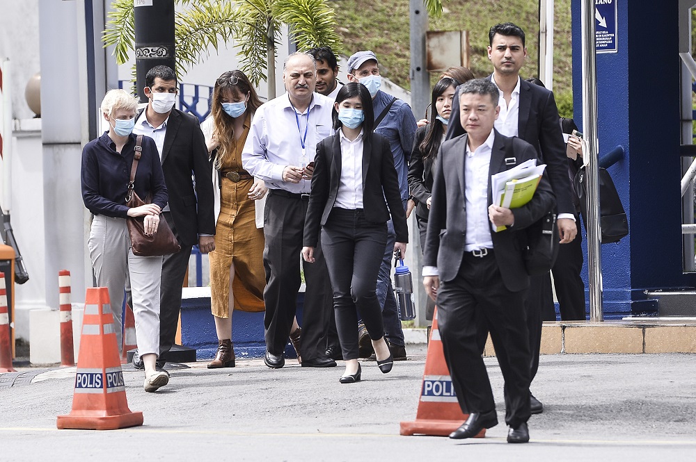 Al Jazeera crew members, accompanied by their lawyers, are seen outside the Bukit Aman headquarters in Kuala Lumpur July 10, 2020. u00e2u20acu2022 Picture by Miera Zulyana