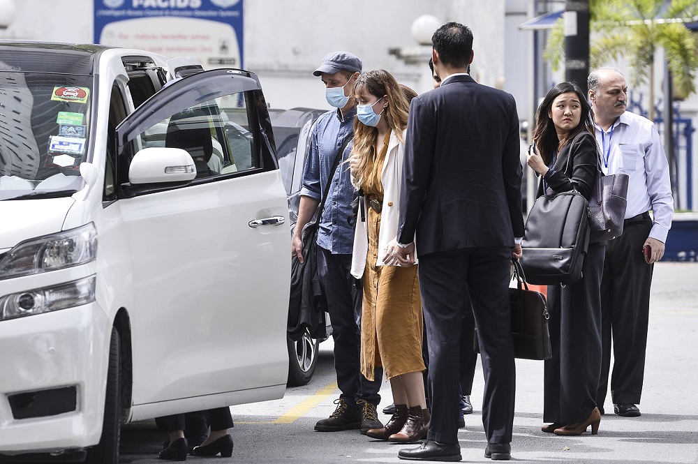 Al Jazeera crew members, accompanied by their lawyers, are seen outside the Bukit Aman headquarters in Kuala Lumpur July 10, 2020. u00e2u20acu2022 Picture by Miera Zulyana