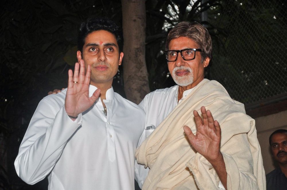 In this file photo taken on November 22, 2011 Bollywood actors Amitabh Bachhan (right) and his son Abhishek Bachchan hold a press conference about their new grand-daughter/ daughter in Mumbai. u00e2u20acu201d AFP pic