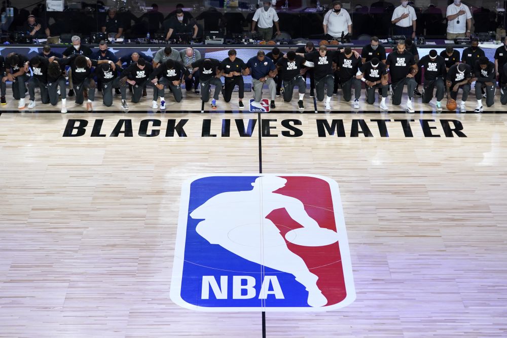 Members of the New Orleans Pelicans and Utah Jazz kneel together around the Black Lives Matter logo on the court during the national anthem before the start of an NBA basketball game July 30, 2020. u00e2u20acu201d Reuters pic