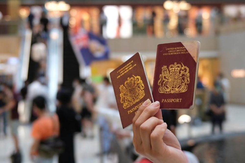 A pro-democracy demonstrator raises his British National Overseas (BNO) passports during a protest against new national security legislation in Hong Kong, China, June 1, 2020. u00e2u20acu201d Reuters pic