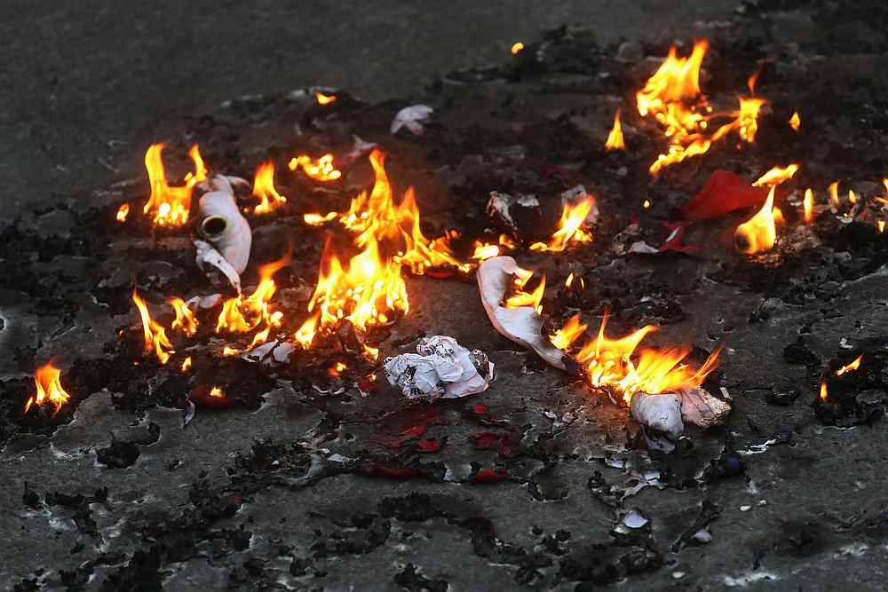 A group of protesters burn an American flag, even as other protesters disagreed with the act, during a protest near Black Lives Matter Plaza in Washington July 4, 2020.  u00e2u20acu201d Reuters pic