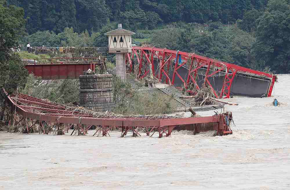 A broken bridge is seen after floods caused by torrential rain, in Kumamura, Kumamoto Prefecture, southwestern Japan, July 8, 2020. u00e2u20acu201d Reuters pic