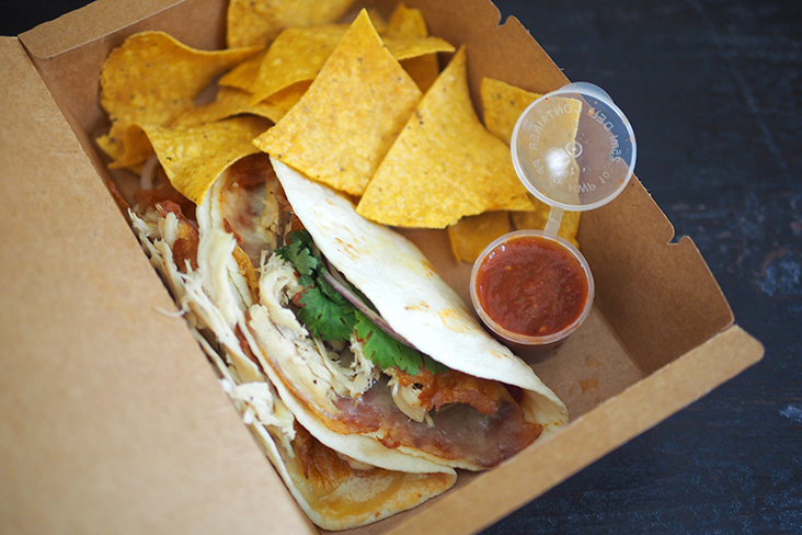There are single meals available like this chicken quesa tacos served with shredded chicken.
