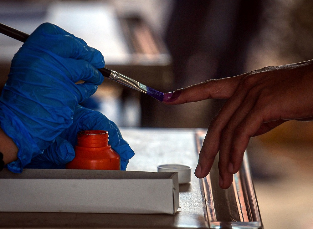 A voter gets his finger marked with indellible ink at the Kelas Al-Quran dan Fardu Ain (KAFA) polling centre in Pekan July 4, 2020. u00e2u20acu2022 Bernama pic