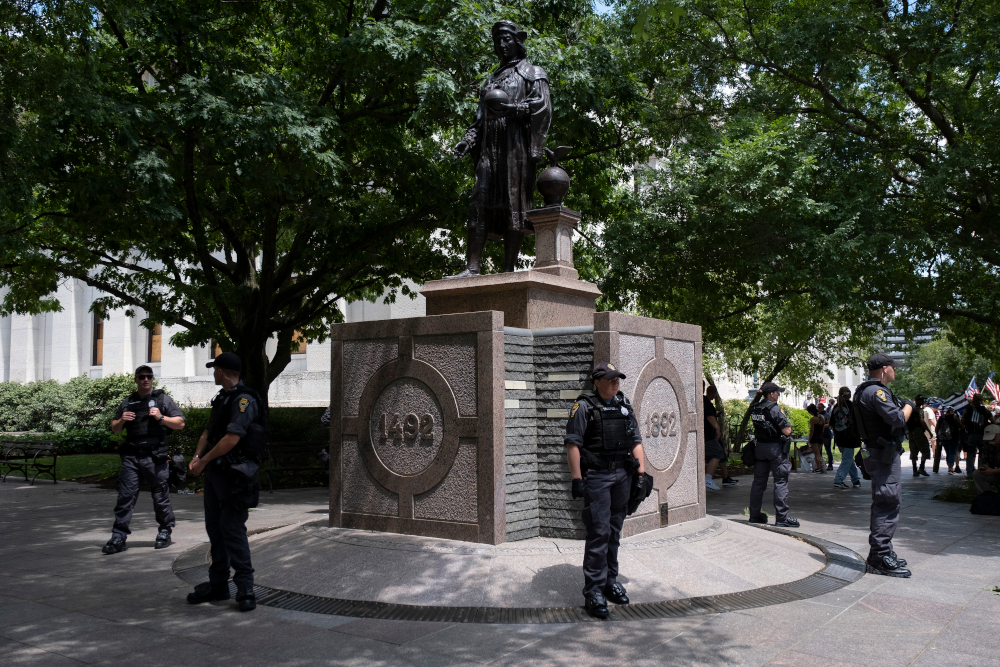 Police officers guard a statue of Christopher Columbus in front of the Ohio Statehouse July 18, 2020 in Columbus, Ohio. u00e2u20acu201d AFP pic 