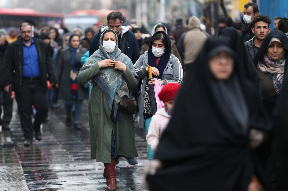Iranian women wear protective masks to prevent contracting a coronavirus, as they walk at Grand Bazaar in Tehran, Iran February 20, 2020. u00e2u20acu201d West Asia News Agency pic via Reuters