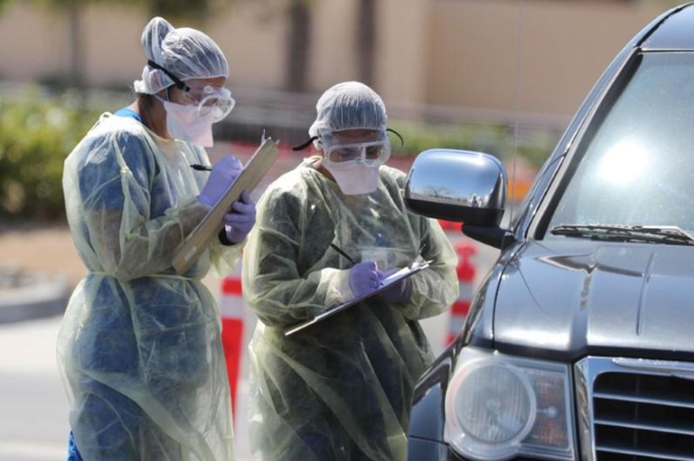 Hospital staff perform drive-thru tests for coronavirus disease (Covid-19) in Indian Wells, California, US, March 26, 2020. u00e2u20acu201d Reuters pic