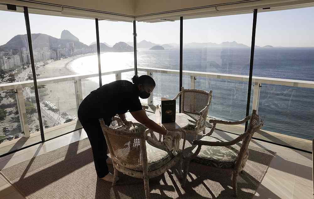 A worker cleans a room at the Othon Palace Hotel amid the outbreak of Covid-19 in Rio de Janeiro, Brazil July 28, 2020. u00e2u20acu201d Reuters pic
